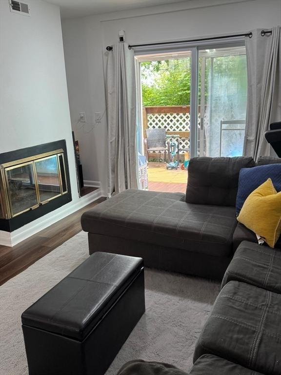 159 Tall Oaks Dr Unit H, Weymouth, MA 02190 - living room featuring wood finished floors and baseboards