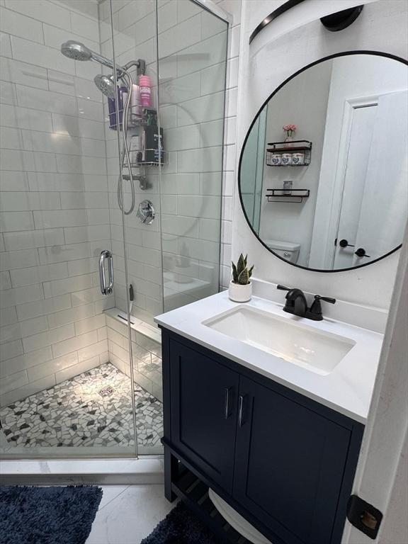159 Tall Oaks Dr Unit H, Weymouth, MA 02190 - bathroom featuring a stall shower, vanity, and marble finish floors