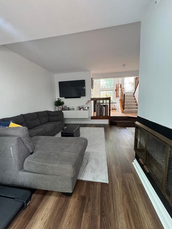 159 Tall Oaks Dr Unit H, Weymouth, MA 02190 - living area with dark wood-style floors and stairs