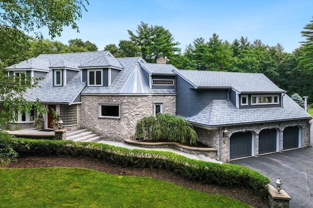 70 Lazell St, Hingham, MA 02043 - shingle-style home featuring stone siding, a chimney, driveway, and a garage