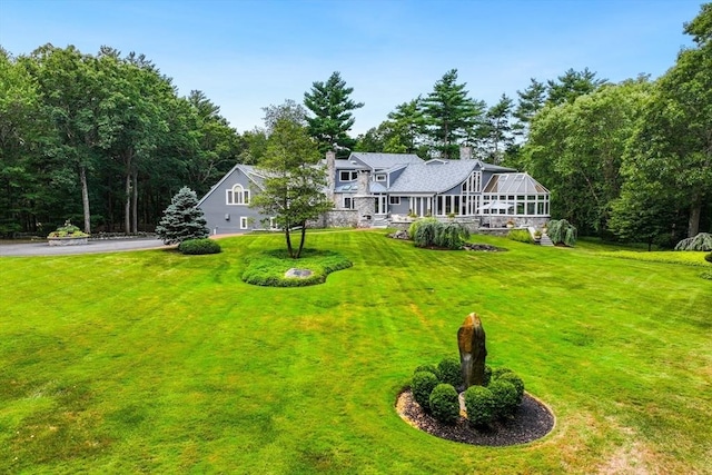 70 Lazell St, Hingham, MA 02043 - view of front of home with a front yard, a chimney, and asphalt driveway