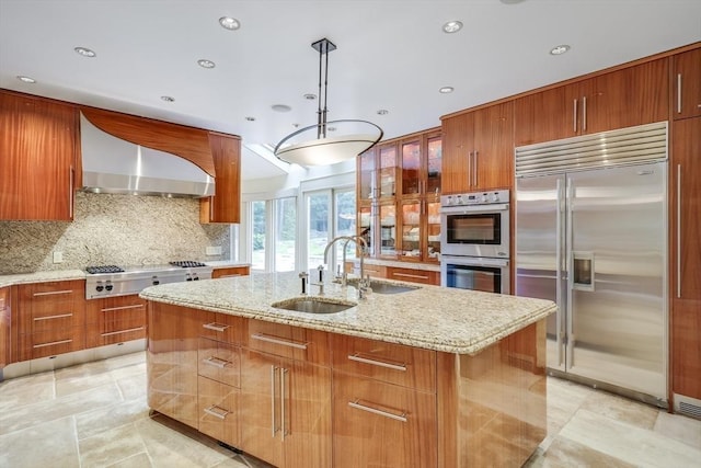 70 Lazell St, Hingham, MA 02043 - kitchen featuring stainless steel appliances, wall chimney range hood, brown cabinets, light stone countertops, and backsplash