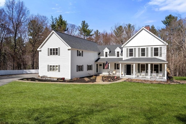 4 Old Meadow Ln, Harvard, MA 01451 - rear view of property featuring roof with shingles, covered porch, a chimney, and a yard