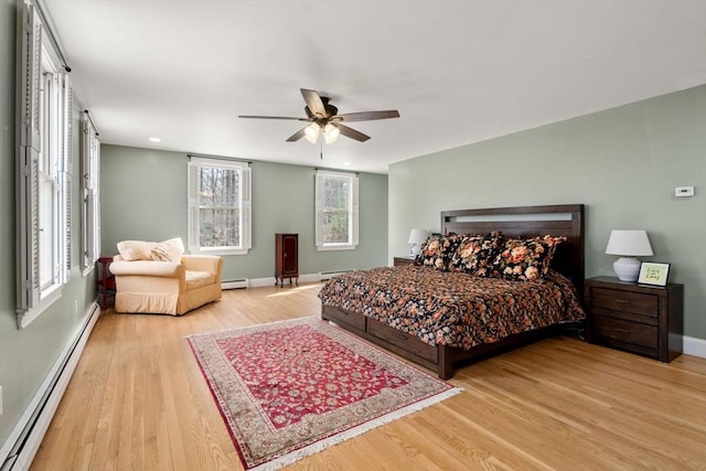 4 Old Meadow Ln, Harvard, MA 01451 - bedroom featuring a ceiling fan, wood finished floors, baseboards, a baseboard radiator, and a baseboard heating unit