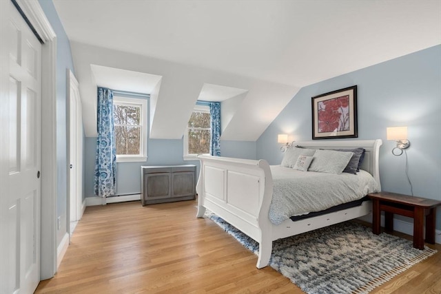 4 Old Meadow Ln, Harvard, MA 01451 - bedroom with light wood-style floors, baseboards, baseboard heating, and lofted ceiling