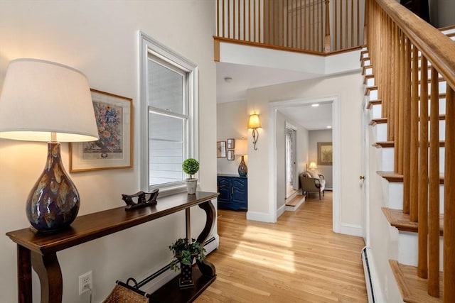 4 Old Meadow Ln, Harvard, MA 01451 - interior space featuring baseboards, a baseboard radiator, light wood finished floors, and stairway