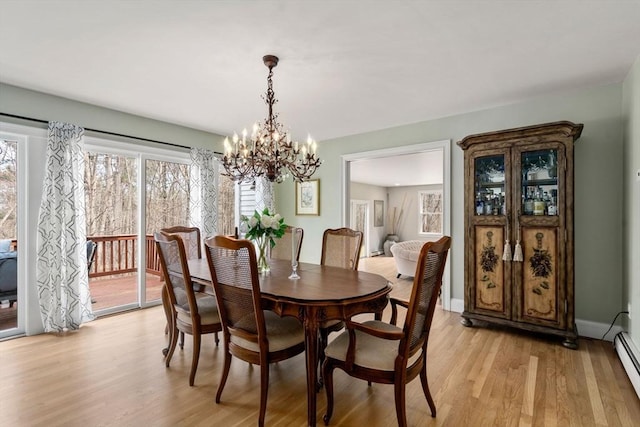 4 Old Meadow Ln, Harvard, MA 01451 - dining room featuring light wood-type flooring, a chandelier, and baseboard heating