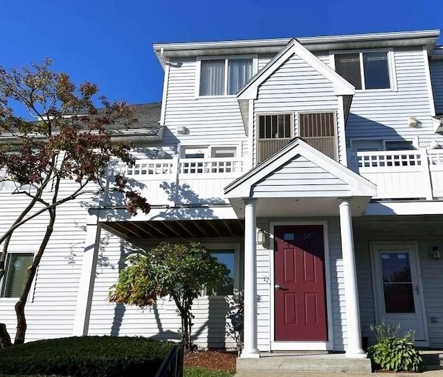 view of front of home with a balcony