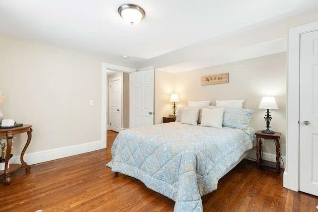 bedroom featuring dark hardwood / wood-style floors