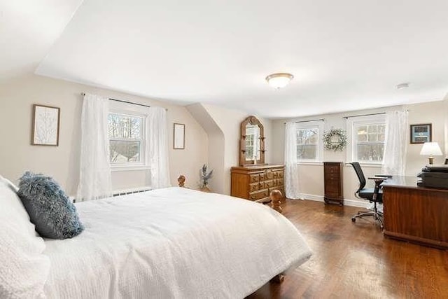 bedroom featuring dark hardwood / wood-style floors and lofted ceiling