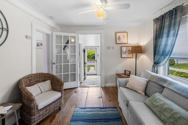 13 Hathaway St, Fairhaven, MA 02719 - living area with hardwood / wood-style flooring, crown molding, a ceiling fan, and baseboards