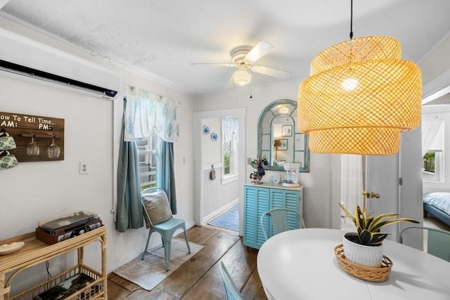 13 Hathaway St, Fairhaven, MA 02719 - dining area with plenty of natural light, a wall mounted AC, wood finished floors, and a ceiling fan