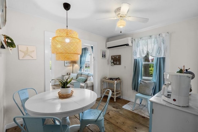 13 Hathaway St, Fairhaven, MA 02719 - dining room with an AC wall unit, wood finished floors, a ceiling fan, and baseboards