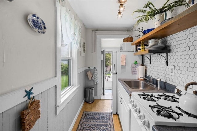 13 Hathaway St, Fairhaven, MA 02719 - kitchen with white range with gas stovetop, open shelves, a sink, white cabinets, and light wood-style floors
