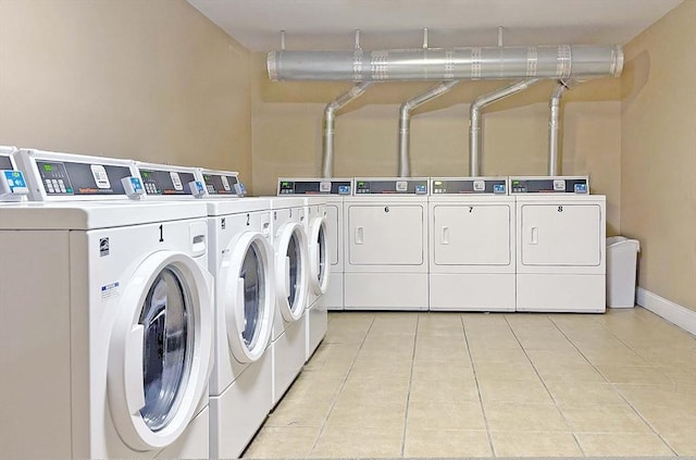 44 Lafayette Ave Unit 503, Chelsea, MA 02150 - communal laundry room with washing machine and dryer, light tile patterned flooring, and baseboards