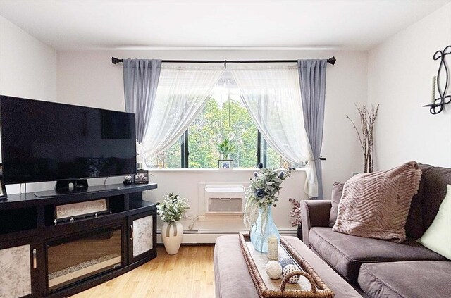 44 Lafayette Ave Unit 503, Chelsea, MA 02150 - living room featuring wood finished floors and a wall mounted air conditioner