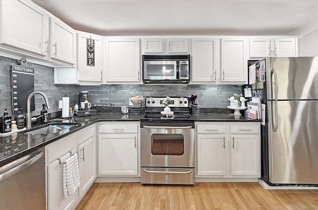 44 Lafayette Ave Unit 503, Chelsea, MA 02150 - kitchen with stainless steel appliances, a sink, white cabinetry, and light wood-style flooring
