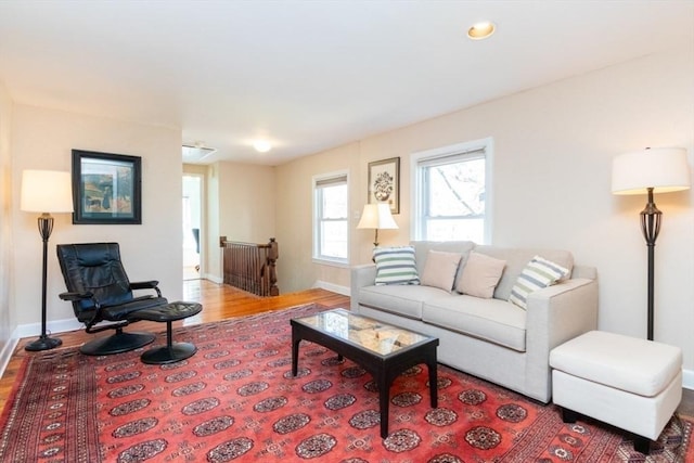 living room featuring baseboards and wood finished floors