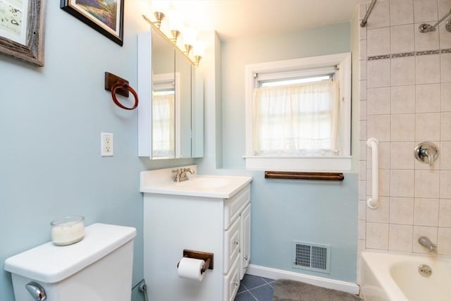 bathroom featuring visible vents, vanity, toilet, shower / tub combination, and tile patterned floors