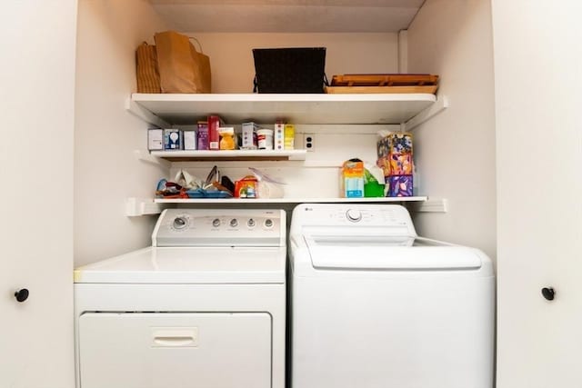 washroom with laundry area and washing machine and dryer