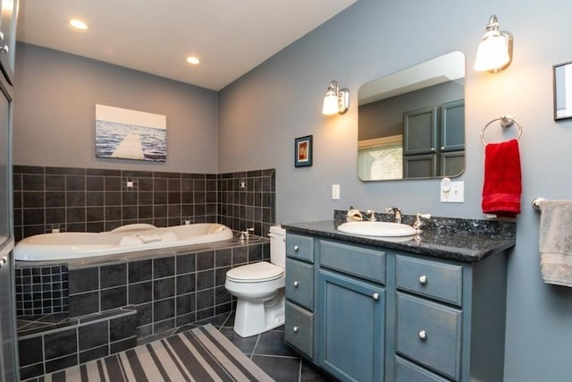 full bath with tile patterned flooring, vanity, toilet, recessed lighting, and a garden tub