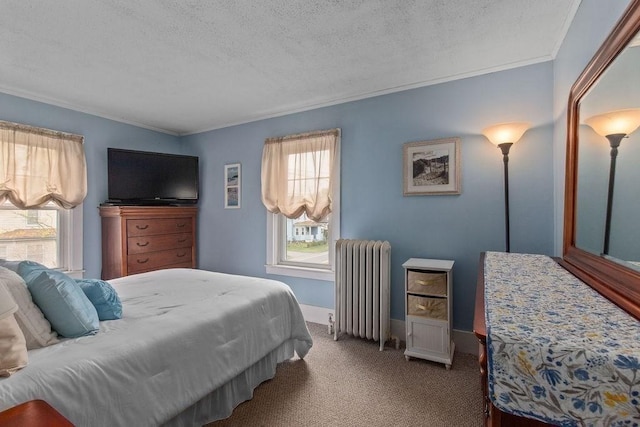 carpeted bedroom featuring multiple windows, a textured ceiling, ornamental molding, and radiator