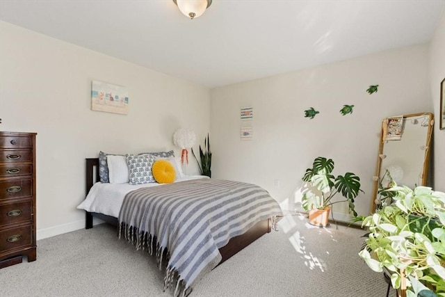 bedroom with light carpet