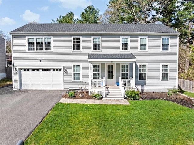 57 Chittenden Rd, Scituate, MA 02066 - view of front of home with a porch, driveway, a garage, and a front yard