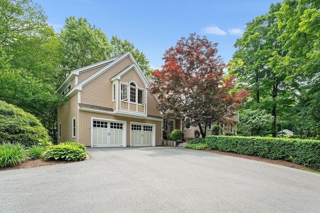 6 Fruit St, Hopkinton, MA 01748 - view of front of home with driveway and a garage