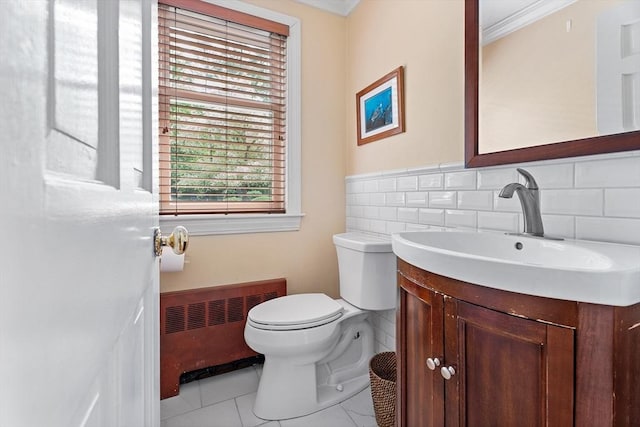 6 Fruit St, Hopkinton, MA 01748 - half bathroom featuring radiator heating unit, vanity, tile patterned flooring, ornamental molding, and tasteful backsplash