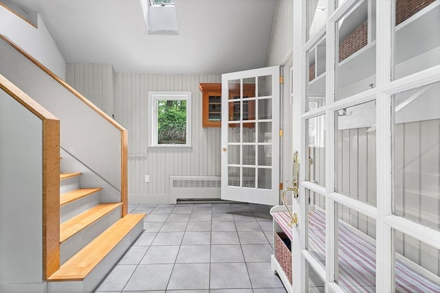 6 Fruit St, Hopkinton, MA 01748 - doorway to outside featuring radiator heating unit, tile patterned floors, and stairs