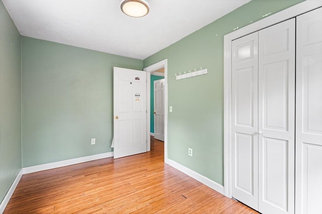 6 Fruit St, Hopkinton, MA 01748 - unfurnished bedroom with light wood finished floors and a closet