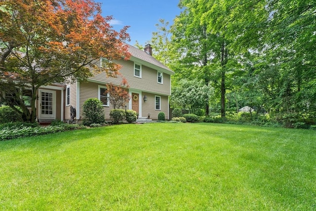 6 Fruit St, Hopkinton, MA 01748 - view of front of property with a chimney and a front lawn