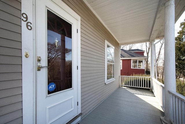 doorway to property featuring a porch