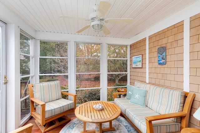 sunroom with wood ceiling and ceiling fan