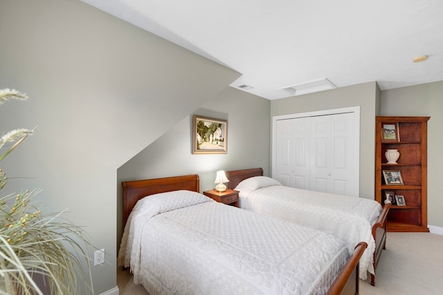 carpeted bedroom featuring a closet