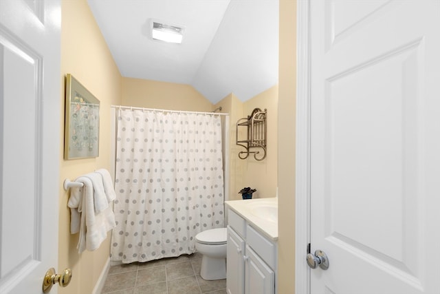 bathroom with vaulted ceiling, toilet, vanity, a shower with shower curtain, and tile patterned flooring