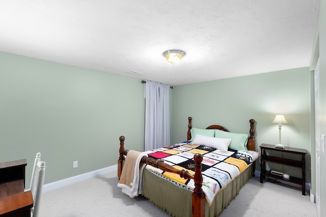 bedroom with light carpet