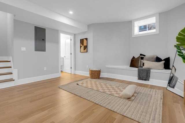 interior space with electric panel and light hardwood / wood-style flooring