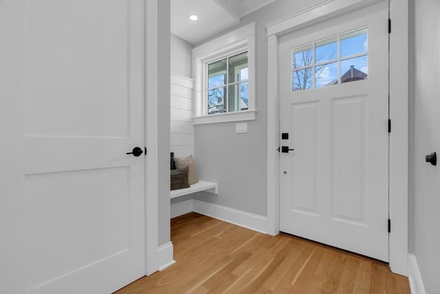 foyer with a wealth of natural light and light hardwood / wood-style flooring