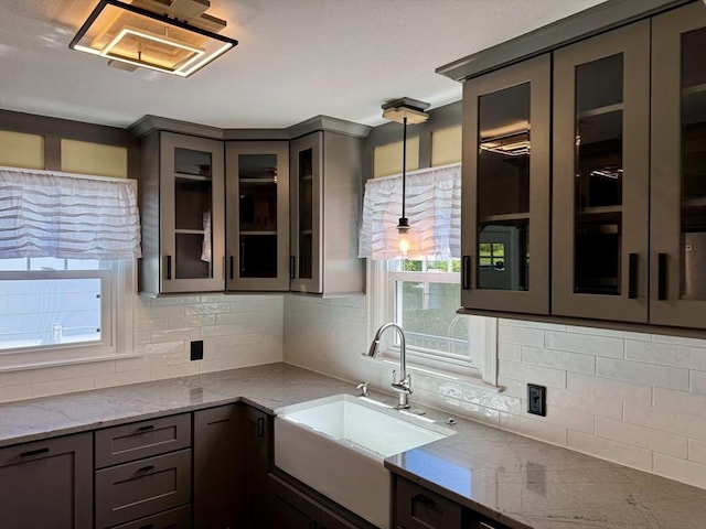 167 Pleasant St, East Longmeadow, MA 01028 - kitchen featuring a sink, healthy amount of natural light, and tasteful backsplash