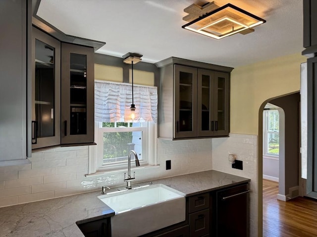167 Pleasant St, East Longmeadow, MA 01028 - kitchen featuring a sink, black dishwasher, healthy amount of natural light, and arched walkways