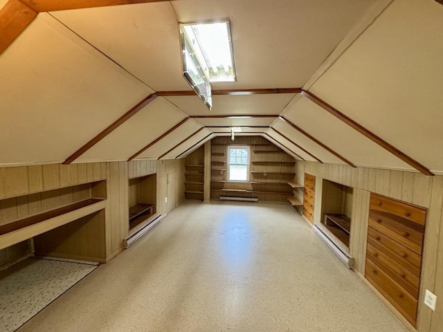 167 Pleasant St, East Longmeadow, MA 01028 - additional living space featuring wooden walls, built in shelves, vaulted ceiling, and baseboard heating