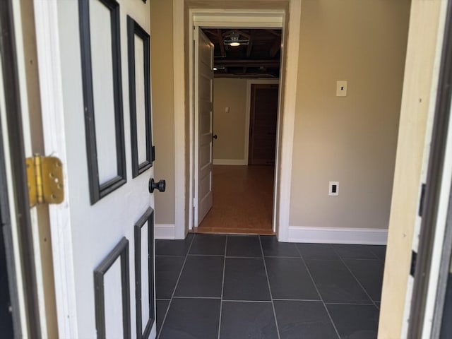 167 Pleasant St, East Longmeadow, MA 01028 - hallway with dark tile patterned floors and baseboards