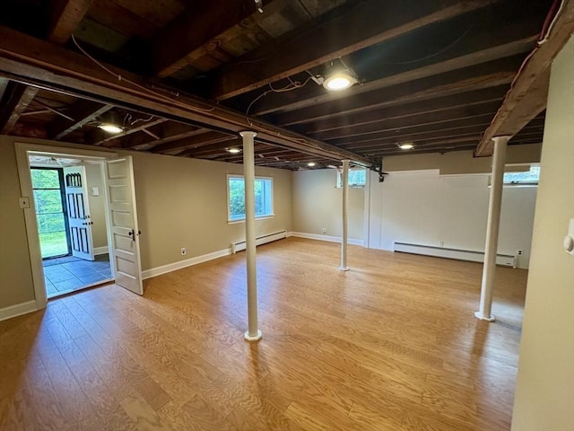 167 Pleasant St, East Longmeadow, MA 01028 - basement featuring a baseboard heating unit, wood finished floors, and baseboards
