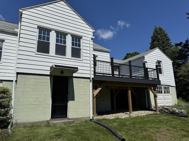 167 Pleasant St, East Longmeadow, MA 01028 - rear view of house featuring a deck and a lawn