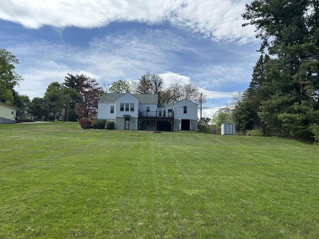 167 Pleasant St, East Longmeadow, MA 01028 - back of house featuring a lawn and a deck
