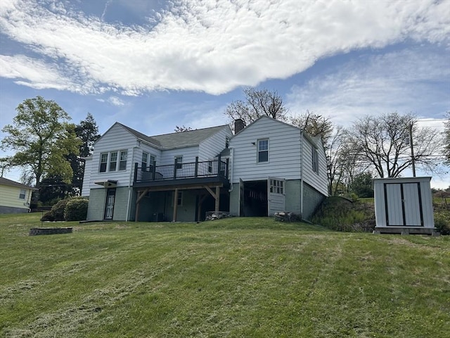 167 Pleasant St, East Longmeadow, MA 01028 - rear view of property featuring a deck, a yard, and a chimney