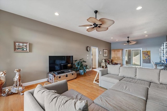 living room featuring recessed lighting, baseboards, ceiling fan, and wood finished floors