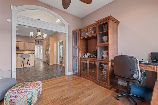 home office with recessed lighting, baseboards, light wood-style flooring, and ceiling fan with notable chandelier